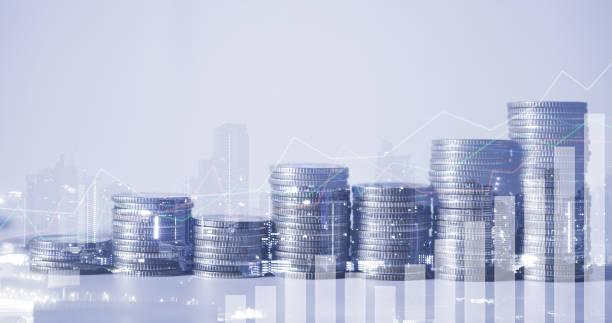istock double exposure of city with row of coin stack with growth chart and graph progress report for business investment finance banking and money saving concept. 1264322387