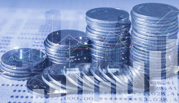 istock double exposure of city with row of coin stack with growth chart and graph progress report for business investment finance banking and money saving concept. 1264322428