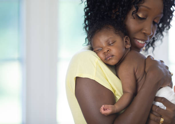 istock Mother and newborn baby together 1264324448