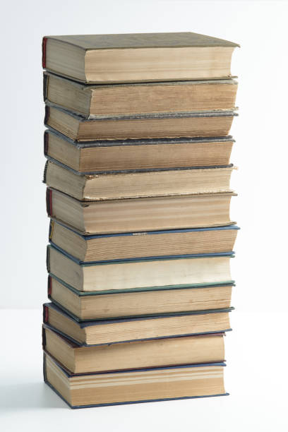 istock A big stack of old, faded, multicolored, yellowed books on a light background. 1264324737