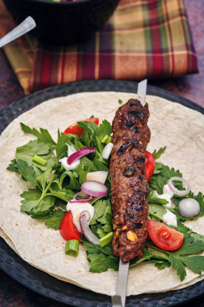 istock Beef Kebab with Flatbread, Vegetable and Green Salad 1264325695