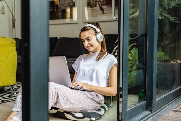 istock Relaxing at home with music and laptop 1264325876