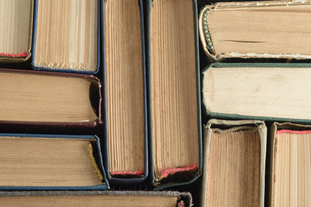 istock An old, faded, multicolor, yellowed books. Minimal style, copy space, top view 1264326349