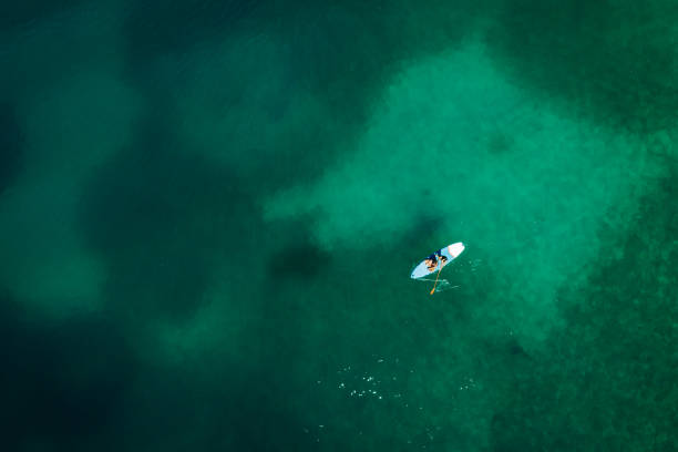 istock Aerial view down to a boat floating on turquoise water 1264326411