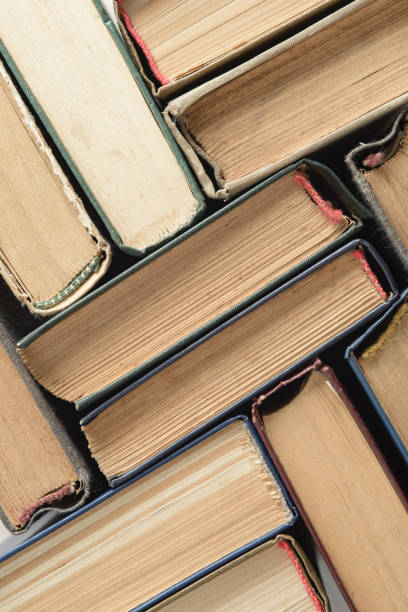 istock An old, faded, multicolor, yellowed books. Minimal style, copy space, top view 1264327330