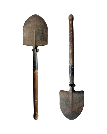 Small old folding shovel on a white isolated background.