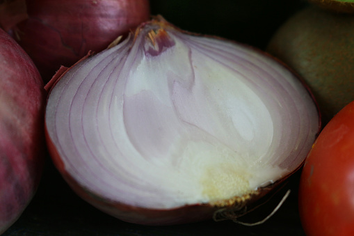 Stock photo showing a close-up view of healthy eating image of a sliced red onion (Allium cepa).