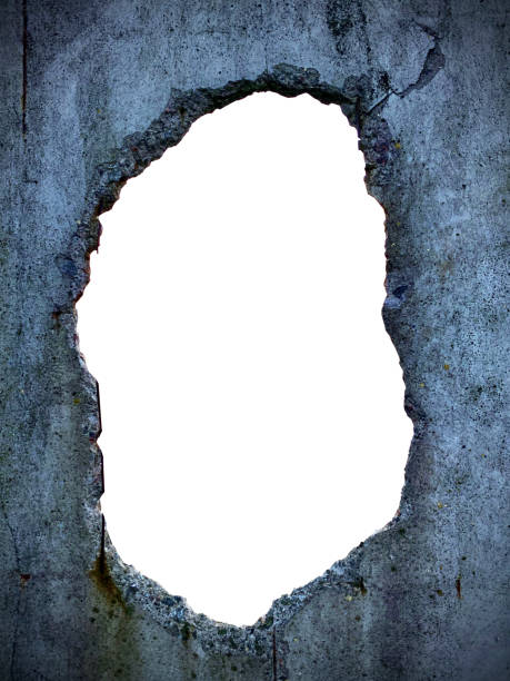 istock through hole in concrete wall and white isolated background 1264329755
