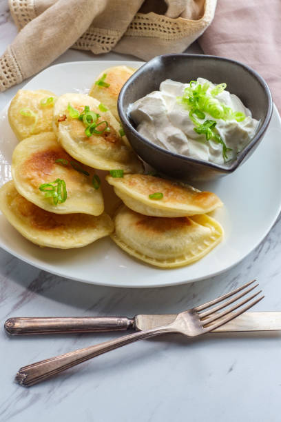 istock Polish Pierogies Sour Cream 1264336998