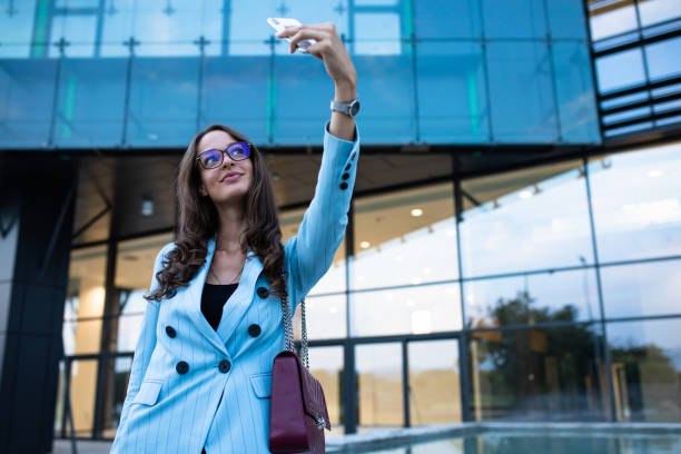 istock A beautiful businesswoman taking a selfie 1264337948