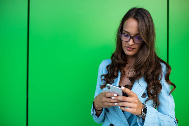 istock A beautiful young woman texting 1264338051