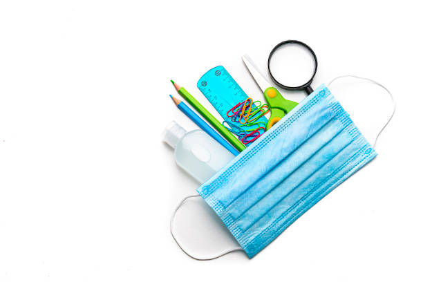istock School supplies, protective face mask and hand sanitizer. Copy space 1264339284