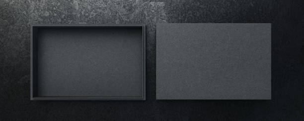 istock black craft cardboard Gift Box Mockup for branding and identity - open flat lay top view isolated on dark surface background 1264339743