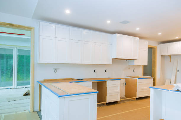 istock Interior design new white kitchen installing cabinets and countertop 1264341379
