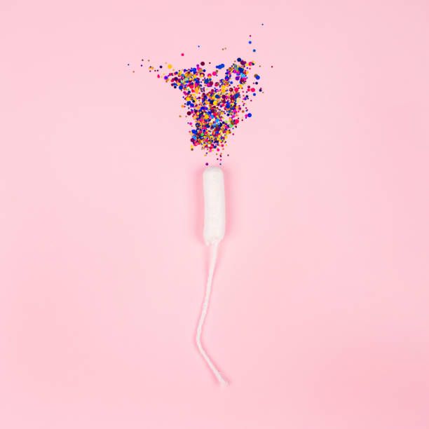 istock Square composition with clean cotton tampon and colorful sparkles on pink background with copyspace for your creative design of blog or leaflet - critical days, hygiene and menstruation concept 1264346581