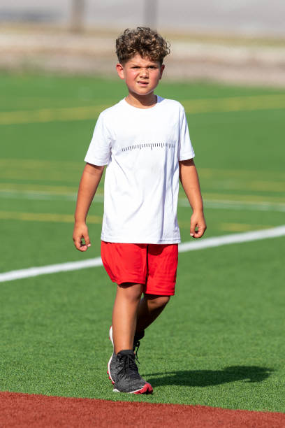istock Young cute boy playing in a Flag Football game 1264349257