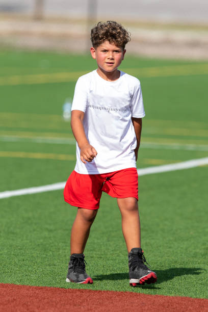 istock Young cute boy playing in a Flag Football game 1264349280