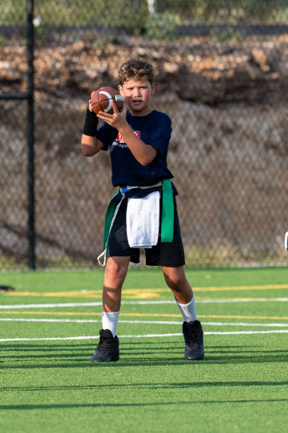 Young boy playing in a flag football game