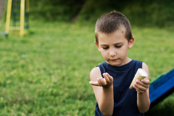 istock Young boy eating ice cream 1264355068