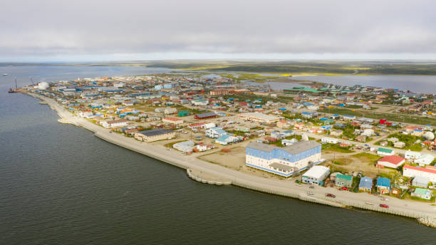 Aerial View Over the Northwest Arctic Borough of Kotzebue Alaska Sun shines burning off the fog in the middle of the night at Kotzebue Alaska creating a beautiful contrast borough district type photos stock pictures, royalty-free photos & images