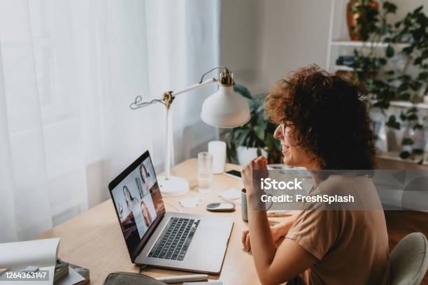 Happy Woman Talking To Friends In A Video Call Coronavirus Prevention Concept Stock Photo - Download Image Now