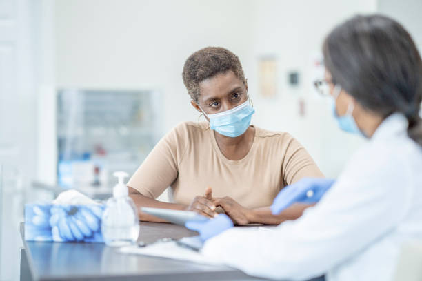istock Doctor and patient in medical exam 1264364962