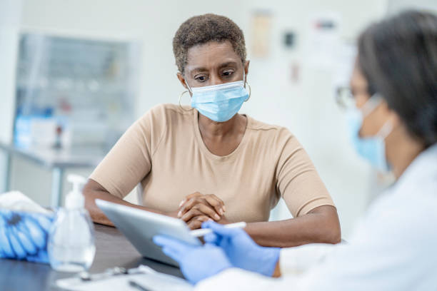 istock Doctor and patient in medical exam 1264364963