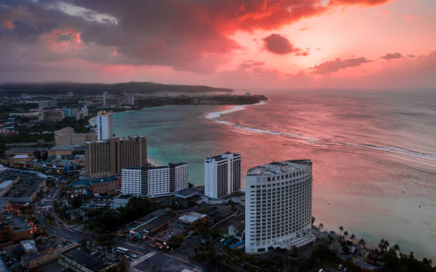 blutiger sonnenuntergang in tumon - guam stock-fotos und bilder