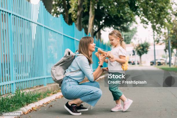Back To School Mother Taking Her Cute Girl To School Stock Photo - Download Image Now