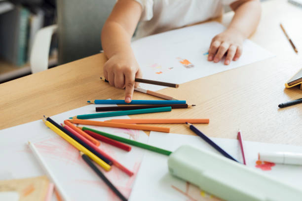 istock Anonymous Girl Selecting Coloured Pencils for a Drawing Activity at Home, Art and Craft Concept 1264365916