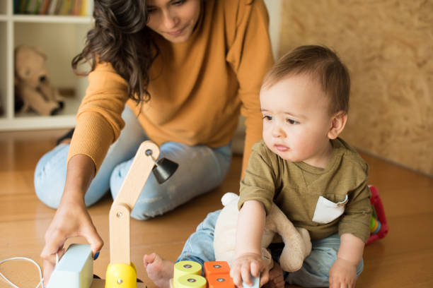 istock Mother playing with her baby 1264366205