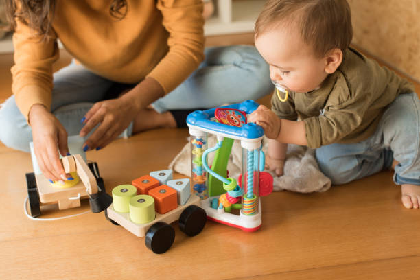 istock Mother playing with toddler at home 1264366217