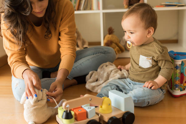 istock Mother playing with toddler at home 1264366218