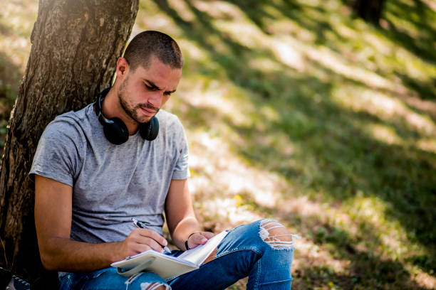 istock Man studying in the city park during the weekend 1264366227