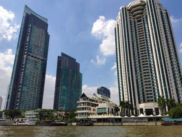 istock tall buildings on the shore of the river 1264369631