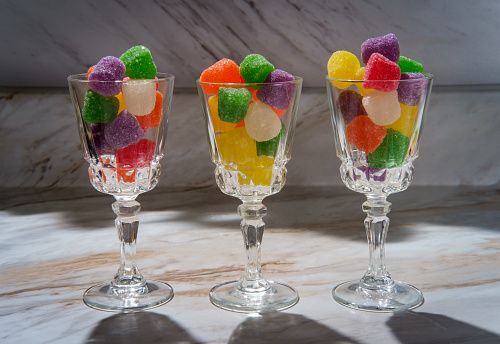 Granulated sugar coated candy gumdrops in shot glasses