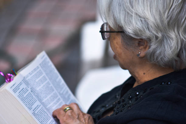 istock adult woman reading a book 1264374190