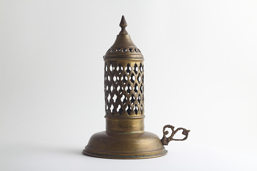 Antique Bronze Candlestick on Isolated White Background.