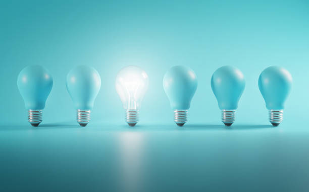 istock Outstanding Idea Concept. Glowing Bulb Between Unlit Blue Bulbs Minimal. 1264375182