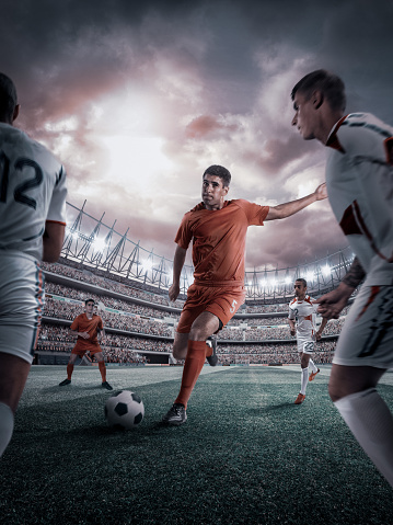 Soccer player in action on stadium background