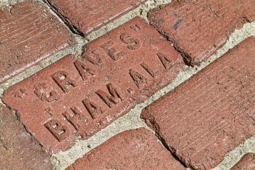 September 11, 2018 - St. Augustine, Florida, United States USA: Details of St Augustine brick streets at town square in St. Augustine, Florida, USA.\n\nSt Augustine is the oldest city in the USA, and was colonized by Spain, the town square saved the spanish heritage. This city is famous by Castillo de San Marcos - St. Mark's Castle National Monument, is the oldest masonry fort in the continental USA. Here the intersection between Castillo Street and Orange Street.\n\nSt. Augustine is 5 hours driving faraway from Miami, and one hour driving from Orlando, Florida.