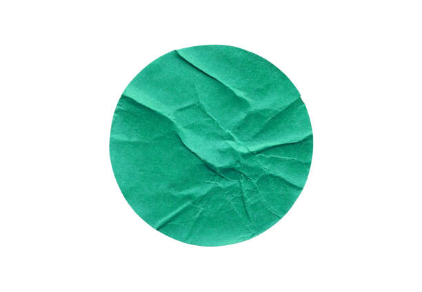 istock Blank green round adhesive paper sticker label isolated on white background 1264378617