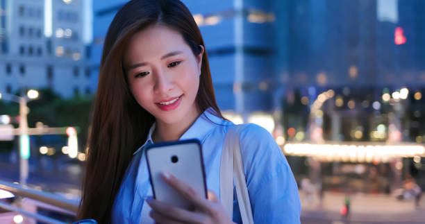 istock woman use smartphone outdoor 1264394704
