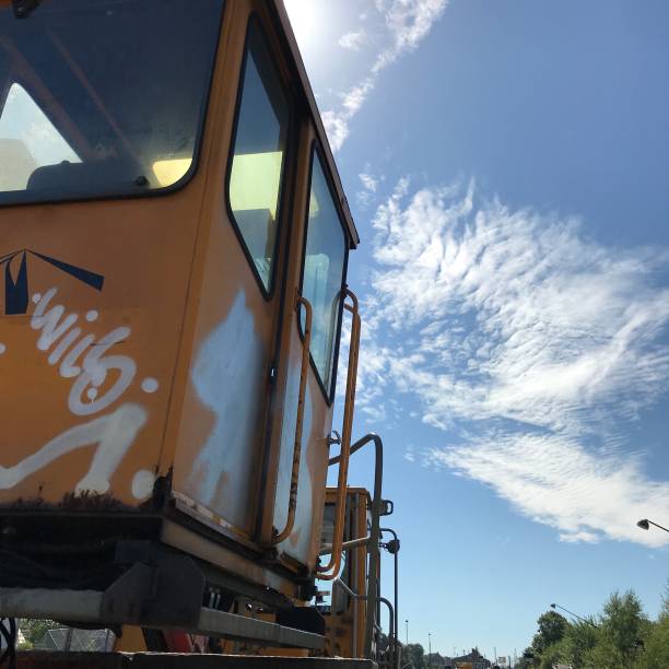 istock Yellow railway trolley set against the blue sky 1264397626