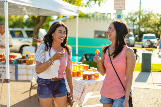 istock Two Female Friends Enjoying a Farmer's Market Together 1264398564
