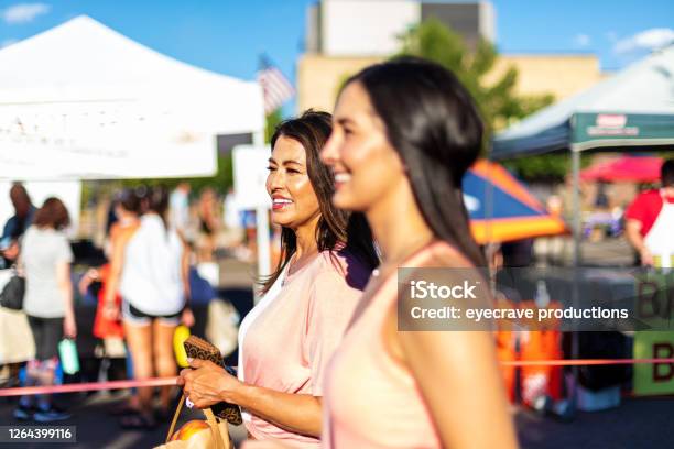 Two Female Friends Enjoying A Farmers Market Together Stock Photo - Download Image Now