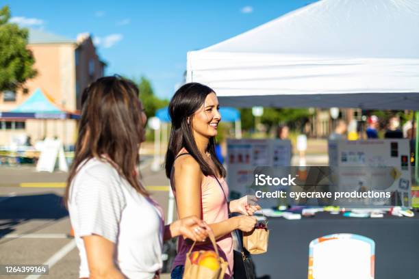 Two Female Friends Enjoying A Farmers Market Together Stock Photo - Download Image Now