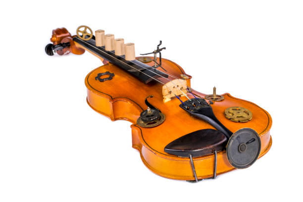 istock Violin with speaker and clockwork parts on white background 1264400705