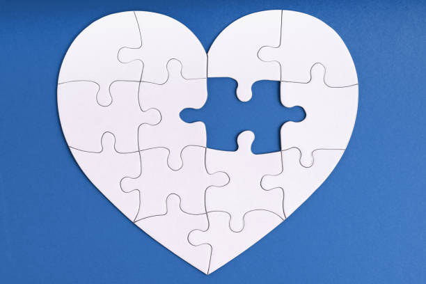 Love, charity, donation, helping concept. Missing piece of jigsaw puzzle in heart shape on blue. Looking for love partner. Uncompleted puzzle. Love, charity, donation, helping concept. Missing piece of jigsaw puzzle in heart shape on blue. Looking for love partner. Uncompleted puzzle. Relationship. Mental health problems, heartache uncompleted stock pictures, royalty-free photos & images