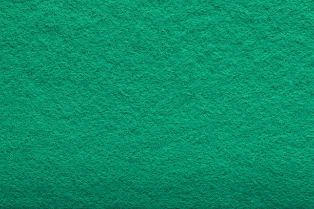 istock shaggy surface. Fine grain felt green fabric. artificial grass. fleecy texture background. 1264403241